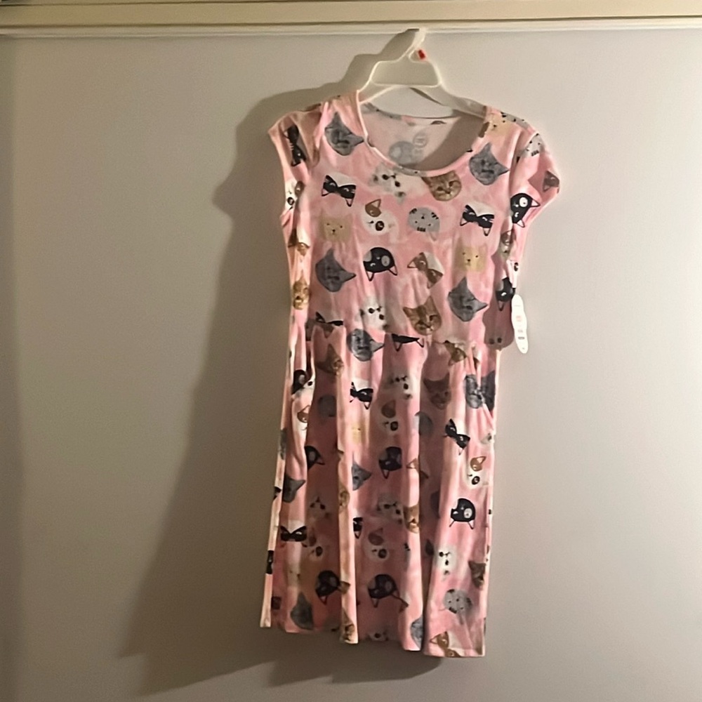 Pink dress with cats on them